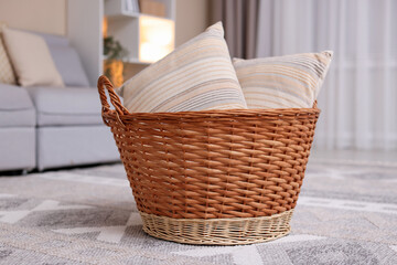 Wicker basket with pillows in living room