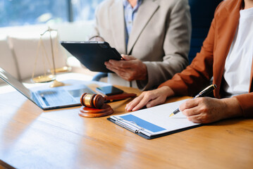 Two lawyers are discussing about contract paper, law matters determination, pointing.law