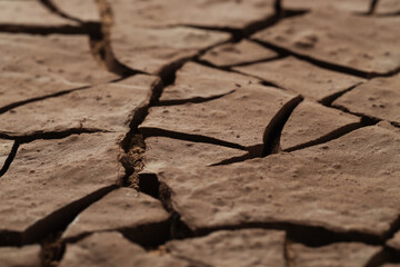 Obraz premium Dry cracked ground as background, closeup. Global warming