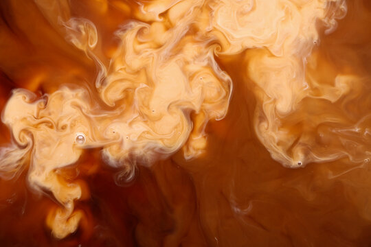 Texture of coffee with milk as background, closeup