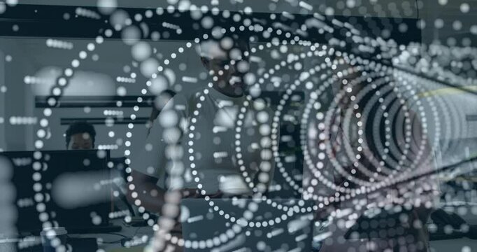 Abstract circular patterns animation over people working in modern office