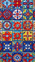 Colorful hand-painted ceramic tiles in traditional Mexican Talavera style with floral and geometric patterns in red, blue, and yellow, arranged in a seamless diagonal layout
