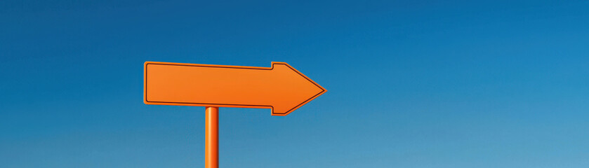 Entrepreneur thinking outside the box. orange road sign pointing right against clear blue sky