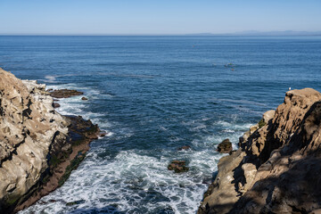 La Jolla Cove is a small cove with a beach that is surrounded by cliffs in La Jolla, a community of San Diego, California.