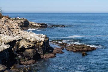 La Jolla Cove is a small cove with a beach that is surrounded by cliffs in La Jolla, a community of San Diego, California.