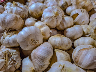 A Bountiful Harvest: Close-Up of Fresh Garlic Bulbs at Farmers Market