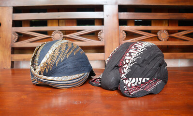 Javanese hat called "blangkon" on wooden background