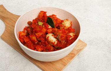 Sambal Goreng Ati Kentang, javanese (Indonesia) traditional food. Served in cream bowl. Copy space. Eid Al Fitr identical food