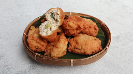 Perkedel tahu or fried tofu patties. Made of mixture; mashed tofu, small amount of tapioca flour, spring onion, egg, salt and pepper and deep fried.