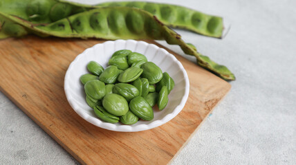 Raw Pete or Petai ,Popular Stinky Bitter Bean on white bowl
