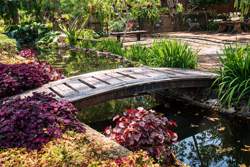 Old wooden bridge with curves with flower