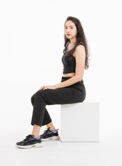 Portrait of asian beautiful woman with curly hair, wearing black tank top black long pants, model...