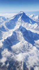 Obraz premium From above, snow-covered peaks rise under a vast, clear sky in a stunning panorama. Vertical.