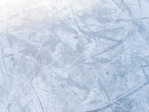 Ice background with marks from skating and hockey. Ice hockey rink scratches surface