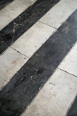 Obraz premium Symmetric Black and White Gray Concrete Floor with Stripes
