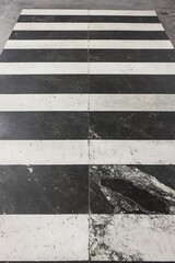 Fototapeta premium Symmetric Black and White Concrete Floor with Striped Design