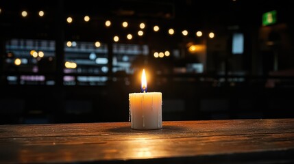 Lit Candle on Wooden Table in Dimly Lit Room with Bokeh Lights Glowing