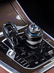 Close up of air freshener with crystal ball and spinner on car dashboard vent