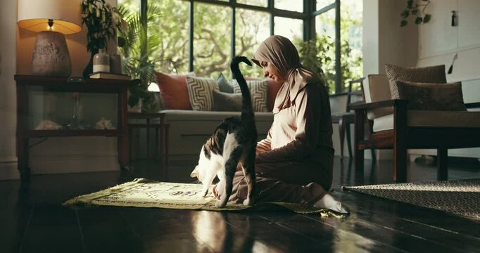 Peace, prayer and muslim woman in home for religion, worship or praise to Allah with cat. Pet animal, spiritual gratitude or Islamic person on mat for Ramadan Kareem, faith or praying for blessings