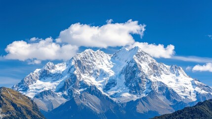 Obraz premium Majestic Snow-Capped Mountain Peaks Under Clear Blue Sky