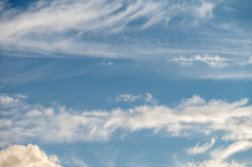 Clouds on a clear Sunny spring sky as a background.