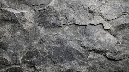 Fototapeta premium An abstract close up of layered grey natural rock surface