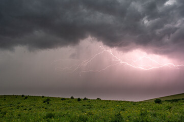 lightning in a field during a thunderstorm