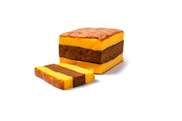 Lapis Surabaya or Surabaya layer cake, is an Indonesian three layer rich sponge cake and strawberry jam in between, isolated on white background