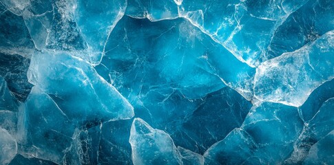 A frozen surface with a natural blue ice texture, adorned with an abstract pattern of white cracks. This flat lay ice texture background serves as a perfect seasonal winter backdrop for ice skating