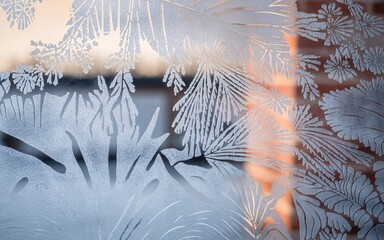 January blues, Winter frost patterns on windowpane, sunrise view
