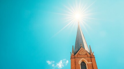 Church steeple reaching for sun on bright blue sky.