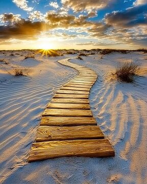 Serene Sunset Over Sandy Dunes with Curved Wooden Pathway Leading to Tranquil Horizon and Dramatic Cloudy Sky