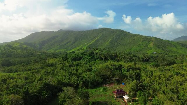 Aerial view of Bacungan foothills and rural homes in warm light