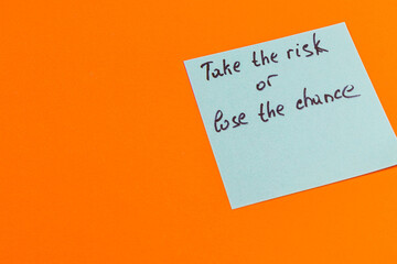 Bright motivational note encourages taking risks for a fulfilled life