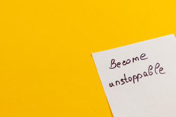 Motivational note promotes positivity on a bright yellow background