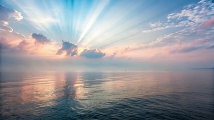 Sunrise Over Ocean serenity glow. Serene sunset over calm water with rays of light breaking through the clouds.