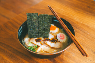 Tonkatsu Ramen, a rich and flavorful pork bone soup with egg and meatballs.
