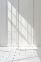Obraz premium Sunlight through window on white wood wall