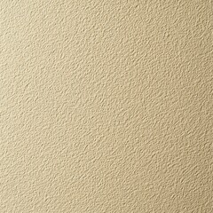 A textured beige wall surface with a subtle, intricate pattern, showcasing a warm and neutral appearance.