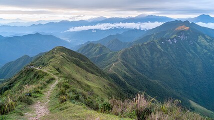 Naklejka premium Vast Mountain Range Panorama Under a Cloudy Sky