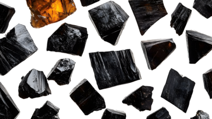 Close-up of coal pieces and fragments arranged on white minimalist design emphasizing fossil fuel and raw material visuals