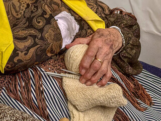 old woman with wool 