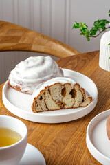 Cinnabon with butter cream half cut