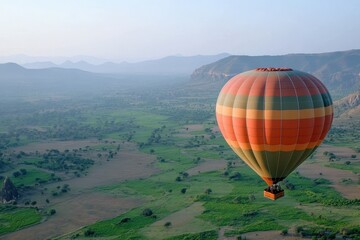 Obraz premium Experience the thrill of adventure tourism with a hot air balloon soaring over a lush green valley at dawn. Generative AI