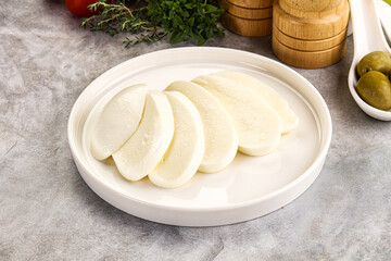 Organic mozzarella cheese slices in the plate