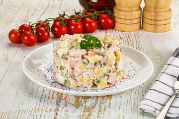 Russian traditional Olivier salad with sausages