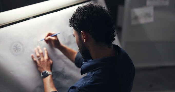 Man, drawing and design for car in workshop, inspiration and editing process for deadline at night. Person, paper and canvas with sketch for electric vehicle, transport and back in studio at company