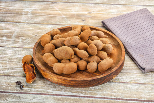 Tropical exotic Tamarind fruit heap