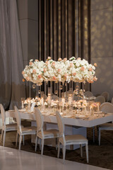 Table setting for a festive dinner or wedding in a restaurant. Luxurious table setting at a festive...