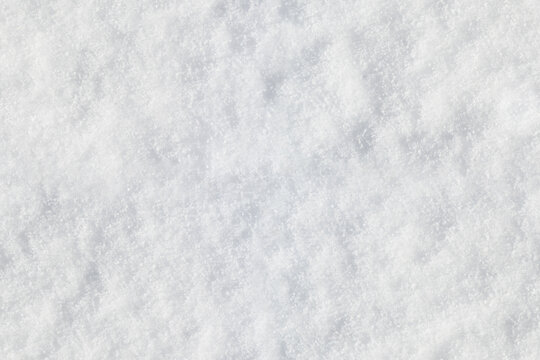 A close-up, high-resolution image of freshly fallen snow, exhibiting a delicate texture with subtle variations in grain and brightness, designed for seamless tiling 